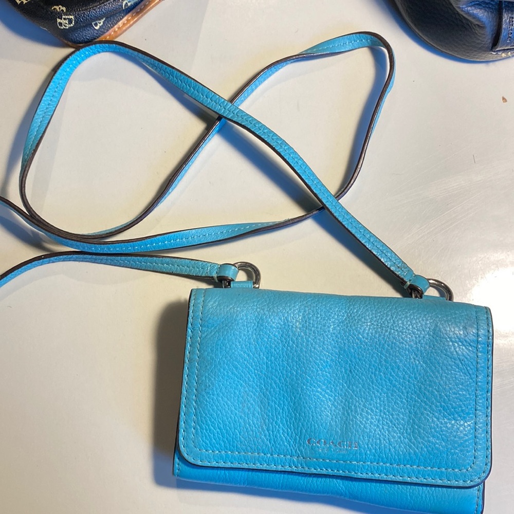 Cute turquoise Coach crossbody bag with lots of pockets!